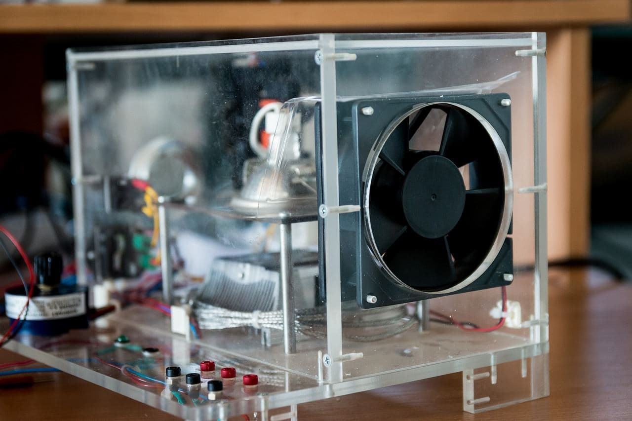 Open desktop computer build with a visible cooling fan and exposed components